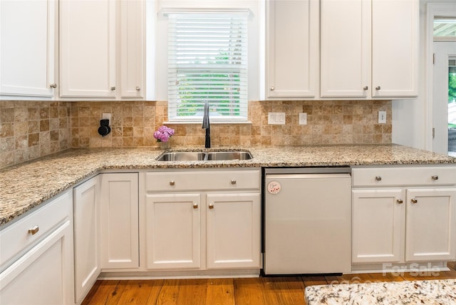 85017 Newloch Ct, Lancaster, SC 29720 - kitchen featuring a sink, dishwashing machine, white cabinetry, light stone counters, and backsplash