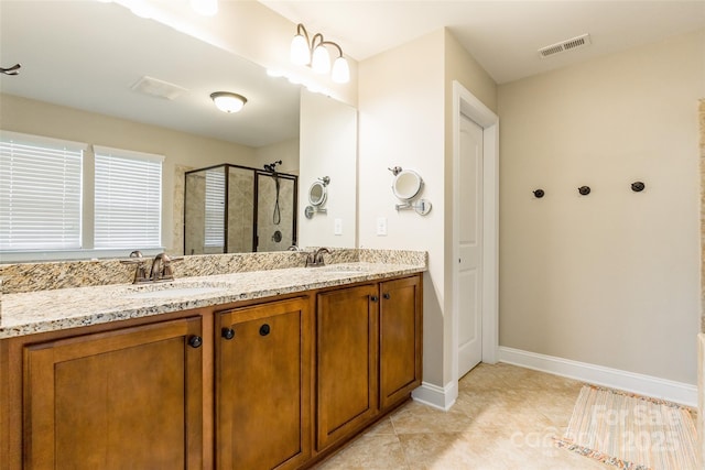 85017 Newloch Ct, Lancaster, SC 29720 - full bath featuring a stall shower, double vanity, tile patterned floors, and baseboards