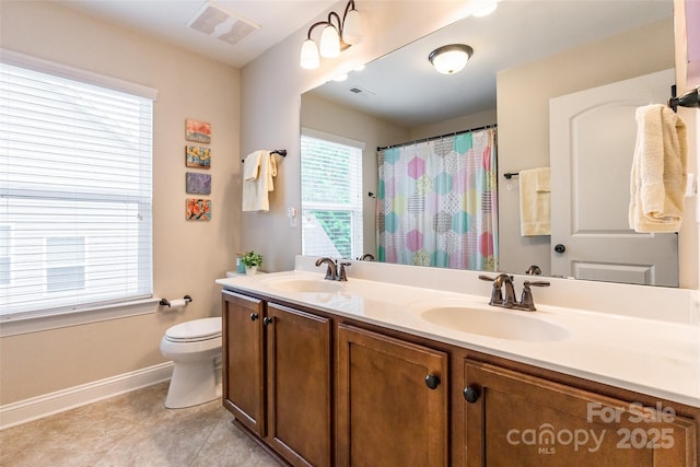 85017 Newloch Ct, Lancaster, SC 29720 - full bath with double vanity, toilet, baseboards, tile patterned floors, and curtained shower