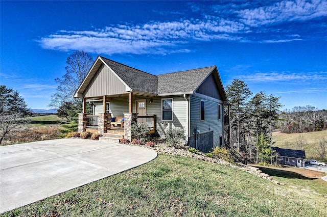 11 Ridge Brook Dr, Weaverville, NC 28787 - view of front facade with a porch, a front lawn, and a shingled roof