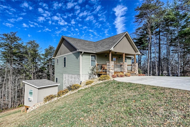 11 Ridge Brook Dr, Weaverville, NC 28787 - view of side of home with covered porch, a lawn, and a shingled roof