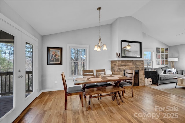 11 Ridge Brook Dr, Weaverville, NC 28787 - dining space featuring light wood-style flooring, plenty of natural light, ceiling fan, high vaulted ceiling, and baseboards