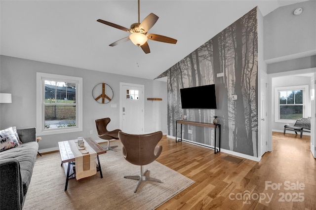 11 Ridge Brook Dr, Weaverville, NC 28787 - living room featuring lofted ceiling, wood finished floors, ceiling fan, and baseboards