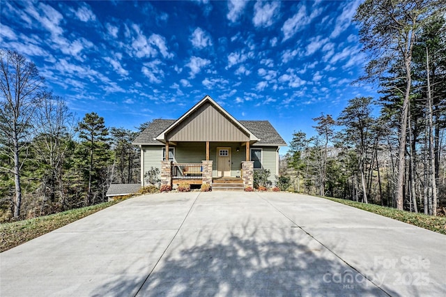 11 Ridge Brook Dr, Weaverville, NC 28787 - craftsman-style home featuring covered porch, board and batten siding, concrete driveway, and a shingled roof