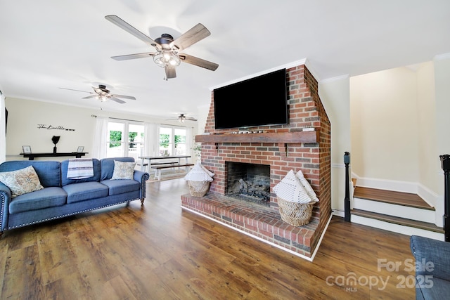 2248 White Heron Rd, Liberty Hill, SC 29074 - living area with wood finished floors, ornamental molding, a ceiling fan, a fireplace, and baseboards
