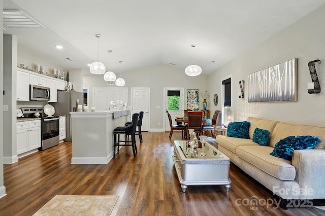 204 Craig St, Mount Holly, NC 28120 - living area with dark wood finished floors and lofted ceiling
