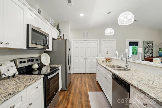 204 Craig St, Mount Holly, NC 28120 - kitchen with stainless steel appliances, a sink, white cabinetry, lofted ceiling, and dark wood-type flooring