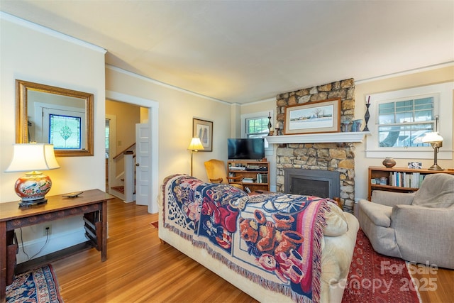 108 Connally St, Black Mountain, NC 28711 - living room featuring wood finished floors, a fireplace, ornamental molding, and stairs