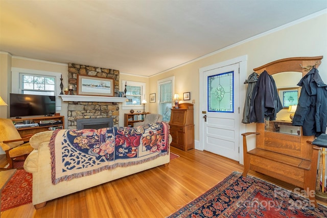 108 Connally St, Black Mountain, NC 28711 - living area with light wood-style flooring, ornamental molding, and a stone fireplace