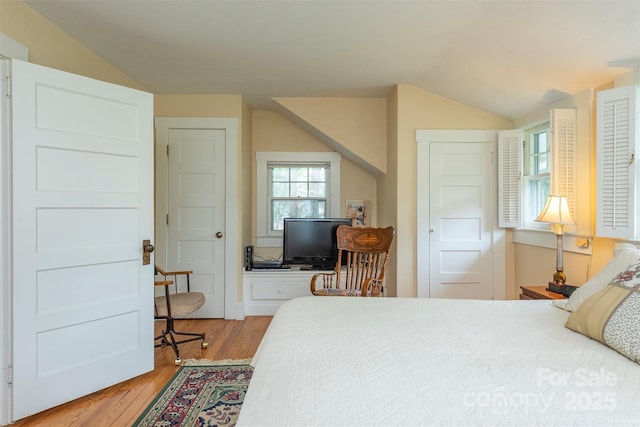 108 Connally St, Black Mountain, NC 28711 - bedroom with lofted ceiling and light wood finished floors