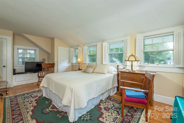 108 Connally St, Black Mountain, NC 28711 - bedroom featuring wood finished floors, vaulted ceiling, and multiple windows