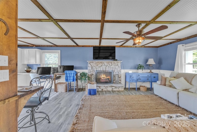 1 Plaza Dr, Granite Falls, NC 28630 - living room featuring a wainscoted wall, wood finished floors, a fireplace, ceiling fan, and coffered ceiling