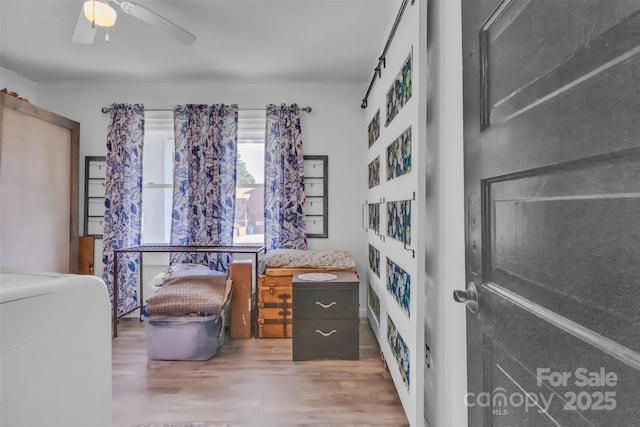 1 Plaza Dr, Granite Falls, NC 28630 - bedroom featuring wood finished floors, washer / clothes dryer, and a ceiling fan