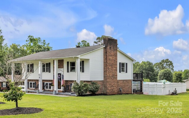 1 Plaza Dr, Granite Falls, NC 28630 - raised ranch featuring a chimney and brick siding