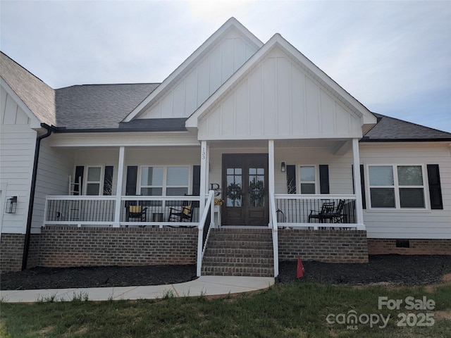 133 Harbourtown Dr, Kings Mountain, NC 28086 - view of front of house featuring board and batten siding, a porch, and roof with shingles