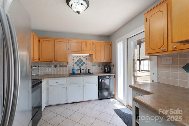 500 Belleview Rd, Rock Hill, SC 29730 - kitchen featuring black appliances, a sink, decorative backsplash, light tile patterned flooring, and light countertops