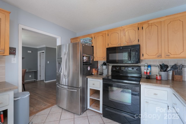 500 Belleview Rd, Rock Hill, SC 29730 - kitchen with black appliances, light tile patterned flooring, ornamental molding, and light countertops