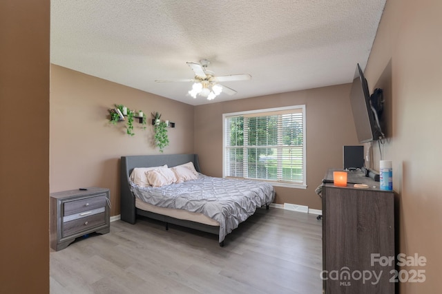 500 Belleview Rd, Rock Hill, SC 29730 - bedroom with light wood-style floors, baseboards, a textured ceiling, and a ceiling fan