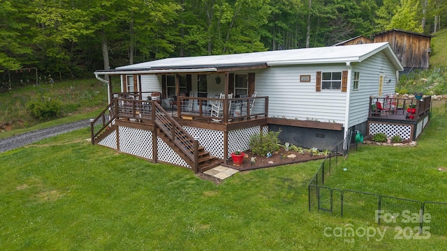 559 Mouth Of Silas Creek Rd, Lansing, NC 28643 - rear view of property with stairs, a wooded view, and a wooden deck
