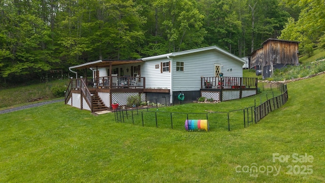 559 Mouth Of Silas Creek Rd, Lansing, NC 28643 - back of property featuring stairs, a wooden deck, and a wooded view