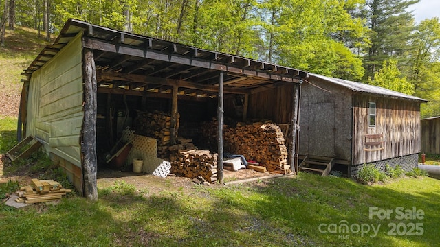 559 Mouth Of Silas Creek Rd, Lansing, NC 28643 - view of pole building with a carport