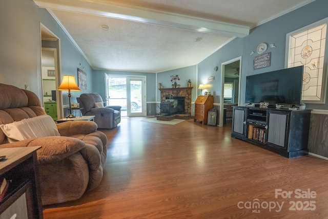 559 Mouth Of Silas Creek Rd, Lansing, NC 28643 - living room with wood finished floors, ornamental molding, and a fireplace