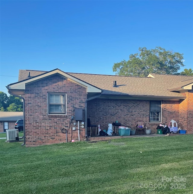 441 Willow Spring Ln, Rock Hill, SC 29730 - back of house with cooling unit, a yard, brick siding, and a shingled roof