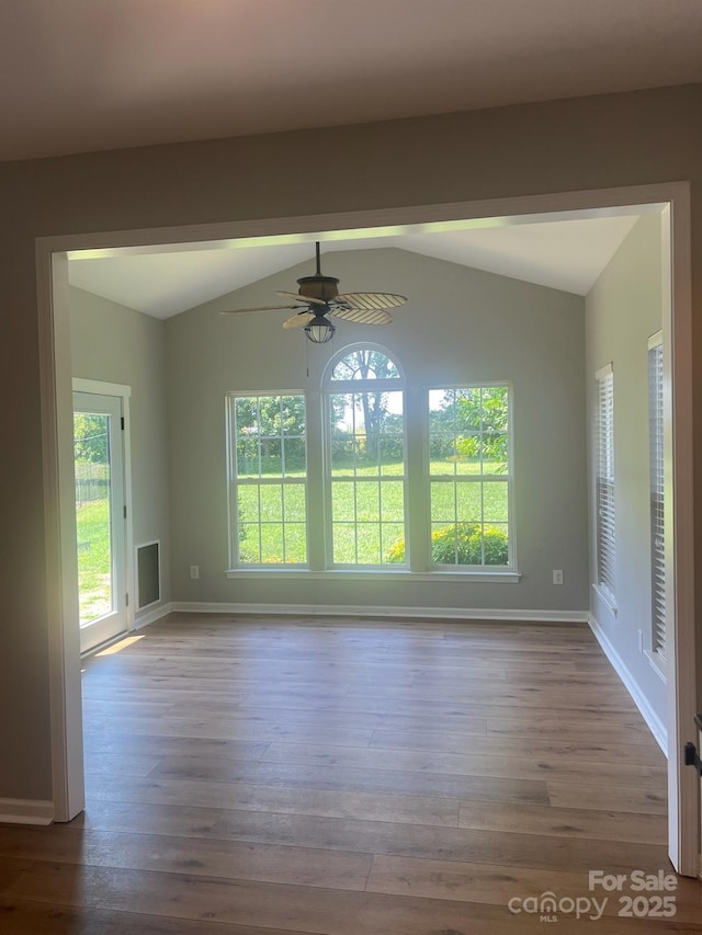 2567 Holly Oak Ln, Gastonia, NC 28056 - unfurnished room featuring vaulted ceiling, ceiling fan, and wood finished floors