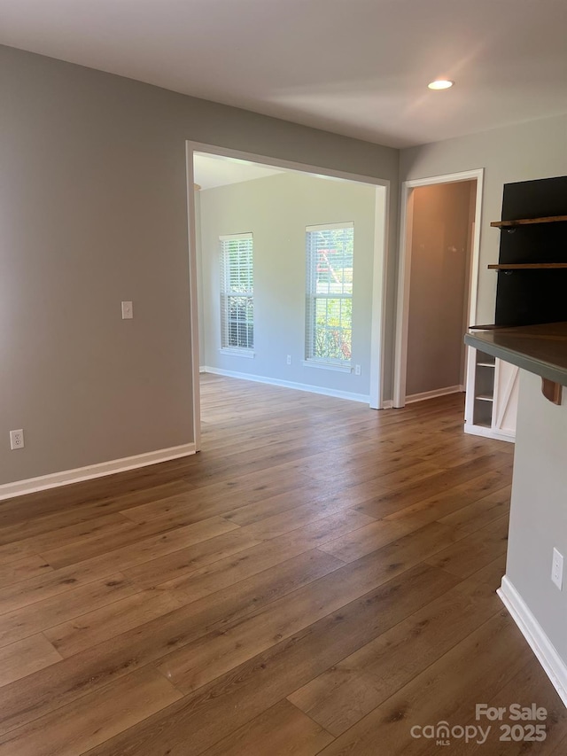 2567 Holly Oak Ln, Gastonia, NC 28056 - spare room with dark wood-style flooring and recessed lighting