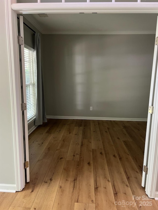 2567 Holly Oak Ln, Gastonia, NC 28056 - empty room featuring ornamental molding and light wood-type flooring