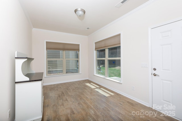 238 Cherrytree Dr, Fort Mill, SC 29715 - unfurnished dining area featuring ornamental molding, wood finished floors, and baseboards