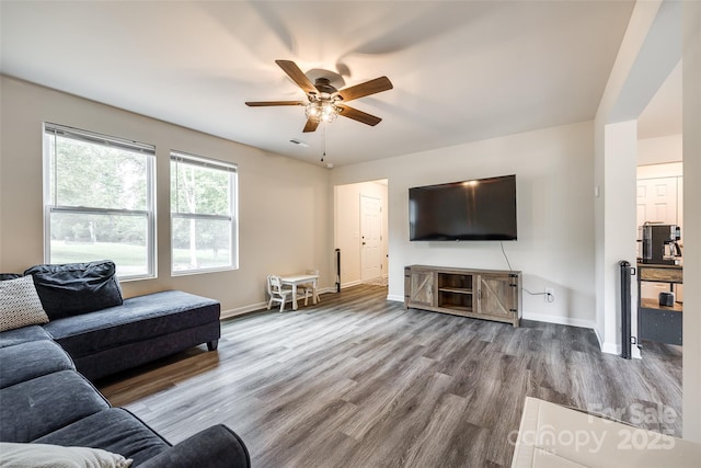 415 Kickapoo Ave, Gastonia, NC 28056 - living area featuring ceiling fan, wood finished floors, and baseboards