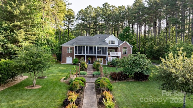 5487 Back Shore Dr, Granite Falls, NC 28630 - view of front of home with brick siding, a front yard, and a deck