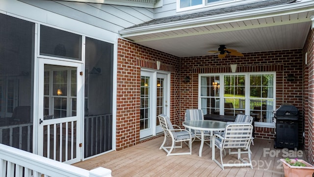 5487 Back Shore Dr, Granite Falls, NC 28630 - wooden deck featuring a ceiling fan, a grill, and outdoor dining space