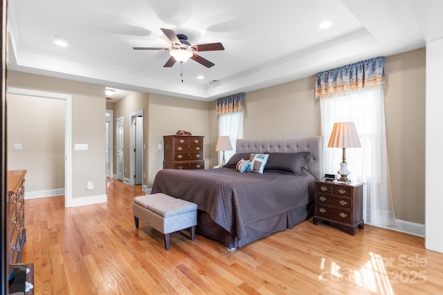5487 Back Shore Dr, Granite Falls, NC 28630 - bedroom featuring a tray ceiling, light wood finished floors, ornamental molding, baseboards, and ceiling fan