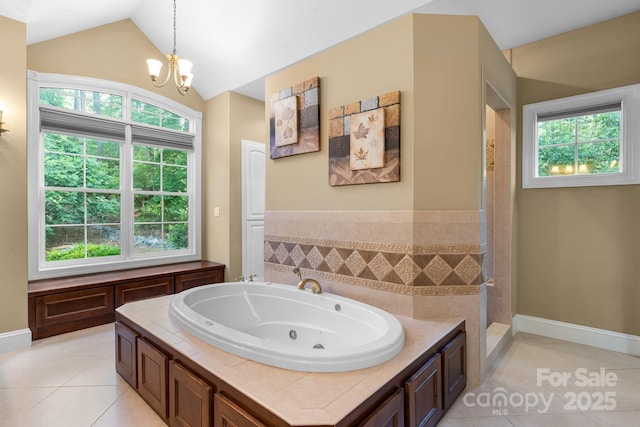 5487 Back Shore Dr, Granite Falls, NC 28630 - bathroom with tile patterned flooring, a whirlpool tub, healthy amount of natural light, vaulted ceiling, and a chandelier