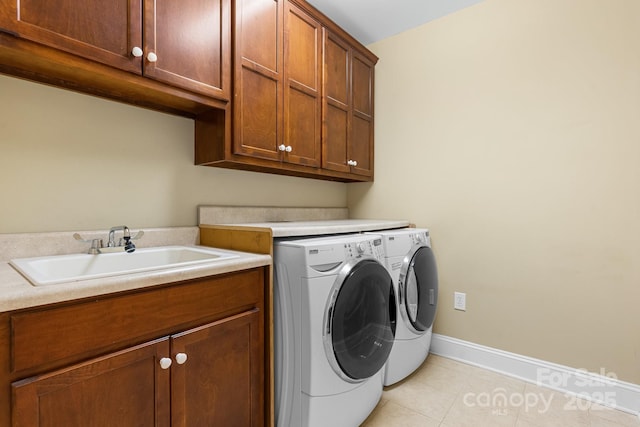 5487 Back Shore Dr, Granite Falls, NC 28630 - laundry area with cabinet space, washing machine and clothes dryer, baseboards, and light tile patterned floors