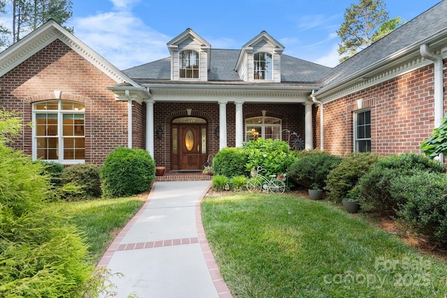 5487 Back Shore Dr, Granite Falls, NC 28630 - entrance to property featuring brick siding, a shingled roof, a lawn, and covered porch