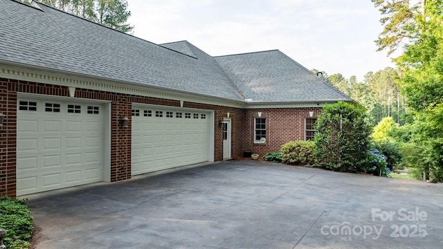 5487 Back Shore Dr, Granite Falls, NC 28630 - view of side of home featuring a shingled roof, brick siding, and driveway