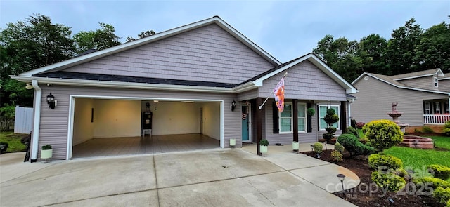 120 Deer Ridge Dr, Hudson, NC 28638 - view of front of home featuring driveway, an attached garage, and covered porch