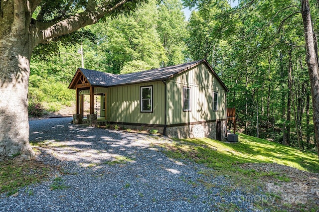 2448 Alfred Hartley Rd, Lenoir, NC 28645 - view of side of home with a view of trees and roof with shingles