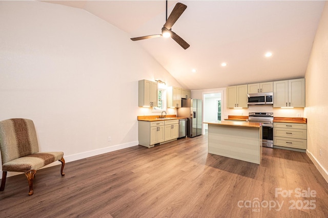 2448 Alfred Hartley Rd, Lenoir, NC 28645 - kitchen with stainless steel appliances, wooden counters, baseboards, wood finished floors, and ceiling fan