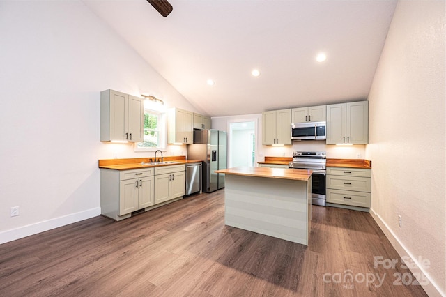 2448 Alfred Hartley Rd, Lenoir, NC 28645 - kitchen featuring wood counters, stainless steel appliances, a sink, lofted ceiling, and dark wood-style floors