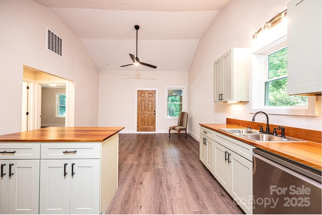 2448 Alfred Hartley Rd, Lenoir, NC 28645 - kitchen featuring stainless steel dishwasher, wooden counters, a sink, vaulted ceiling, and ceiling fan