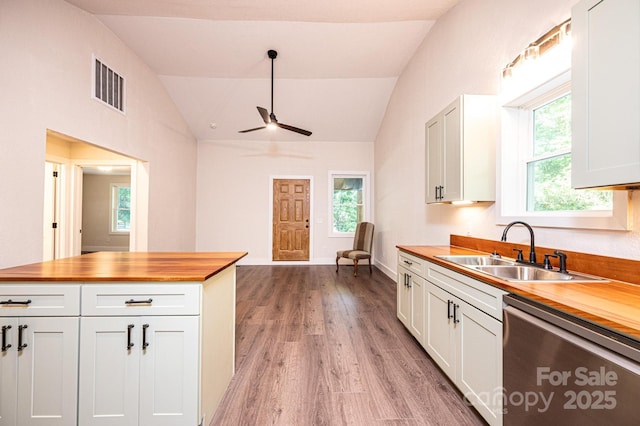 2448 Alfred Hartley Rd, Lenoir, NC 28645 - kitchen with wood counters, a sink, dishwasher, vaulted ceiling, and ceiling fan