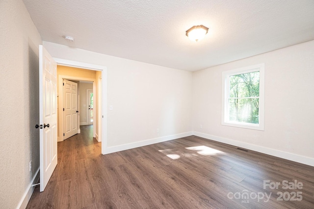 2448 Alfred Hartley Rd, Lenoir, NC 28645 - spare room with dark wood-style flooring and baseboards