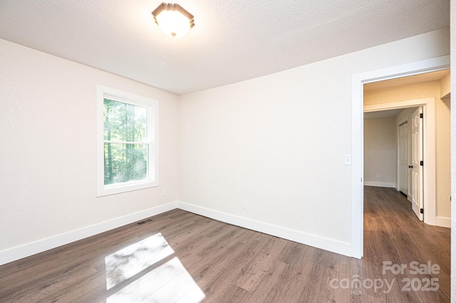2448 Alfred Hartley Rd, Lenoir, NC 28645 - spare room featuring wood finished floors and baseboards