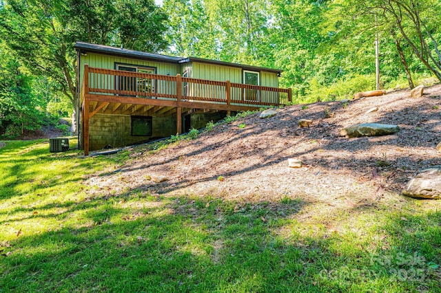 2448 Alfred Hartley Rd, Lenoir, NC 28645 - rear view of property featuring a deck, central air condition unit, and a yard