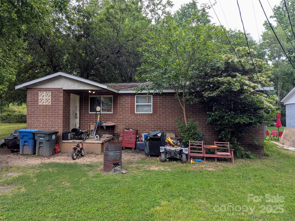 1210 Grady St, Salisbury, NC 28144 - rear view of property with brick siding and a lawn