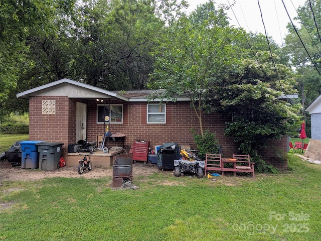 1210 Grady St, Salisbury, NC 28144 - rear view of property with brick siding and a lawn